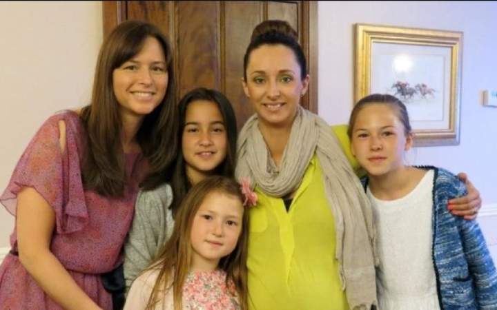 Melia McEnery with her daughters and stepdaughters